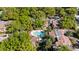 Aerial view showcases the community's unique pool design and lush landscaping at 1092 E Michigan St # 1, Orlando, FL 32806