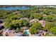 Beautiful aerial view showcases the community pool and lush landscaping near a lake at 1092 E Michigan St # 1, Orlando, FL 32806