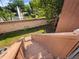 Backyard view featuring a pond with a fountain beyond the wall, and wooden stairs at 1092 E Michigan St # 1, Orlando, FL 32806