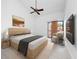 Bright bedroom with vaulted ceiling, neutral tones, and a sliding glass door to a balcony at 1092 E Michigan St # 1, Orlando, FL 32806