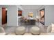 Dining area featuring a marble table, modern chandelier and access to a private balcony at 1092 E Michigan St # 1, Orlando, FL 32806