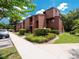 Well-maintained condominium building with mature landscaping and ample parking at 1092 E Michigan St # 1, Orlando, FL 32806