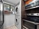 Bright kitchen features stainless steel appliances and a stacked washer/dryer for added convenience at 1092 E Michigan St # 1, Orlando, FL 32806