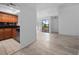 Bright living room with light wood floors that flows into a cozy kitchen space at 1092 E Michigan St # 1, Orlando, FL 32806