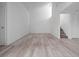 Bright, spacious living room with new flooring and ample natural light from the high windows at 1092 E Michigan St # 1, Orlando, FL 32806