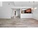 Spacious, bright living room features new light-toned flooring and a kitchen with breakfast bar at 1092 E Michigan St # 1, Orlando, FL 32806