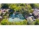 Aerial view of tennis courts and lush surroundings in a well-maintained community at 1092 E Michigan St # 1, Orlando, FL 32806