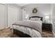 A stylish bedroom features soft gray walls, white trim and doors, and an elegant area rug at 115 Ellington Pl, Oviedo, FL 32765