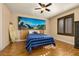 A beach themed bedroom with blue bedding, wood floors, and shuttered windows at 115 Ellington Pl, Oviedo, FL 32765