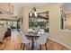 Cozy breakfast nook with a view of the screened-in pool and patio at 115 Ellington Pl, Oviedo, FL 32765