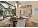 Bright breakfast nook featuring a chandelier and sliding glass door to the pool area at 115 Ellington Pl, Oviedo, FL 32765