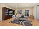 Exercise room with wood floors, gym equipment, TV, and french doors at 115 Ellington Pl, Oviedo, FL 32765
