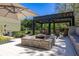 Relaxing backyard fire pit with patio and seating area, great for enjoying cool evenings at 115 Ellington Pl, Oviedo, FL 32765