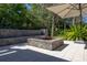 Backyard fire pit with brick surround and built-in seating, perfect for cozy gatherings at 115 Ellington Pl, Oviedo, FL 32765