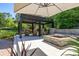 Inviting backyard fire pit with seating area, perfect for outdoor relaxation and gatherings at 115 Ellington Pl, Oviedo, FL 32765