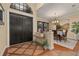 A foyer showcasing tiled flooring, double front doors, and an adjacent dining room at 115 Ellington Pl, Oviedo, FL 32765