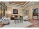 Well-lit living room with comfortable seating, neutral colors, and elegant decor at 115 Ellington Pl, Oviedo, FL 32765