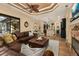 Open living room area leading into kitchen, with decorative ceiling and ample seating at 115 Ellington Pl, Oviedo, FL 32765