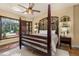 Inviting main bedroom with a four-poster bed, plantation shutters, and lots of natural light at 115 Ellington Pl, Oviedo, FL 32765