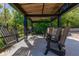 Covered outdoor seating area with comfortable chairs, ideal for entertaining guests at 115 Ellington Pl, Oviedo, FL 32765