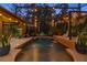 Lovely screened in pool with water features and outdoor string lights for relaxing evenings at 115 Ellington Pl, Oviedo, FL 32765