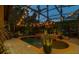 Inviting backyard pool area with fountain features, string lights, and privacy landscaping, creating a relaxing oasis at 115 Ellington Pl, Oviedo, FL 32765