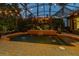 Beautiful pool area with water features, elegant string lights, and a stylish pergola, perfect for outdoor entertaining at 115 Ellington Pl, Oviedo, FL 32765