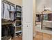 Spacious walk-in closet with custom shelving and ample storage, located off the main bedroom at 115 Ellington Pl, Oviedo, FL 32765