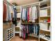 Organized walk-in closet offers abundant storage and shelving, keeping clothes and accessories tidy at 115 Ellington Pl, Oviedo, FL 32765