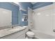 Bright bathroom with granite countertop and tiled shower and bathtub at 1174 Tupelo Trl, Haines City, FL 33844