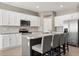 Modern kitchen featuring an island, stainless steel appliances and white cabinets at 1174 Tupelo Trl, Haines City, FL 33844