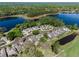 Aerial view of the homes in the community, surrounded by water and mature trees at 1188 Brampton Pl, Lake Mary, FL 32746