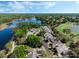 Aerial view of lakeside homes, golf course, and lush landscape at 1188 Brampton Pl, Lake Mary, FL 32746