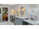 Bathroom with dual vanity sinks, custom mirrors, modern fixtures, and ample counter space at 1188 Brampton Pl, Lake Mary, FL 32746