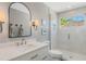 Modern bathroom features white subway tile, a glass shower, and updated fixtures at 1188 Brampton Pl, Lake Mary, FL 32746