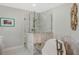 Bathroom with a soaking tub, frameless shower, and modern fixtures at 1188 Brampton Pl, Lake Mary, FL 32746