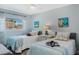 Cozy bedroom with light walls, two twin beds, and bright art at 1188 Brampton Pl, Lake Mary, FL 32746