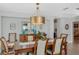 Inviting dining space with wood table, cabinet, decor, and chandelier at 1188 Brampton Pl, Lake Mary, FL 32746