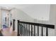 Hallway featuring hardwood floors and an open view to the entryway and a bathroom at 1188 Brampton Pl, Lake Mary, FL 32746