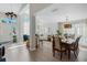 Bright and airy living room with high ceilings, an open floor plan, and beautiful wood floors at 1188 Brampton Pl, Lake Mary, FL 32746