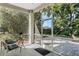 Inviting screened porch with comfortable seating and a view of the lush backyard at 1188 Brampton Pl, Lake Mary, FL 32746