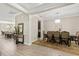 Open-concept design featuring stylish wood-look flooring, connecting the dining area to the kitchen and living areas at 12002 Angle Pond Ave, Windermere, FL 34786