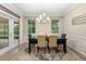 Dining room area featuring a chandelier and natural light from the windows at 12002 Angle Pond Ave, Windermere, FL 34786