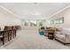 Spacious living room featuring plush carpeting, recessed lighting, and multiple windows for ample natural light at 12002 Angle Pond Ave, Windermere, FL 34786