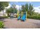 Community playground featuring slides, monkey bars, and a wood chip safety surface at 12002 Angle Pond Ave, Windermere, FL 34786