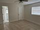 Bedroom with tile flooring, ensuite bathroom, and closet at 1328 Highland Cir, Kissimmee, FL 34744