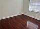 This bedroom features hardwood flooring, natural light, and neutral walls at 1328 Highland Cir, Kissimmee, FL 34744
