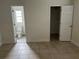 Bedroom featuring ensuite bathroom and closet at 1328 Highland Cir, Kissimmee, FL 34744