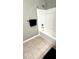 Bathroom features a bathtub with white tile surround and a towel rack at 1400 Lake Shadow Cir # 10105, Maitland, FL 32751