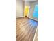 A bright bedroom features wood-look flooring and a spacious walk-in closet for ample storage at 1400 Lake Shadow Cir # 10105, Maitland, FL 32751